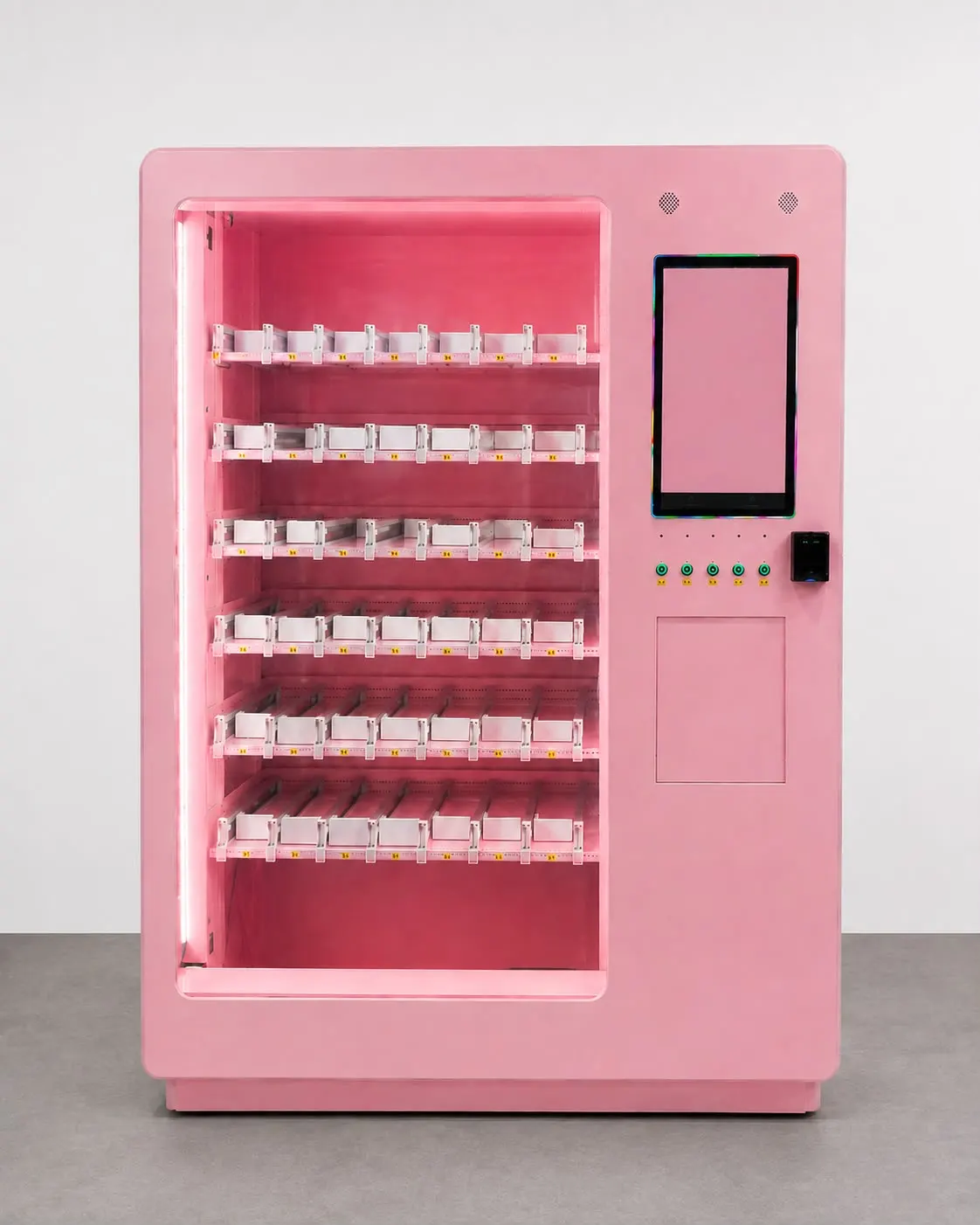 boxed. perfume machine in rosé, sliding channels on several levels behind lit glass and a portrait touchscreen beside it.